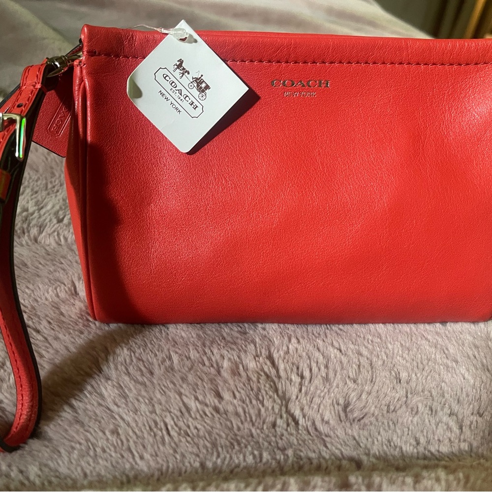 NWOT  Coach burnt orange wristlet/wallet